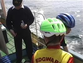 The ferrman takes payment from our youngsters on the St Mawes ferry